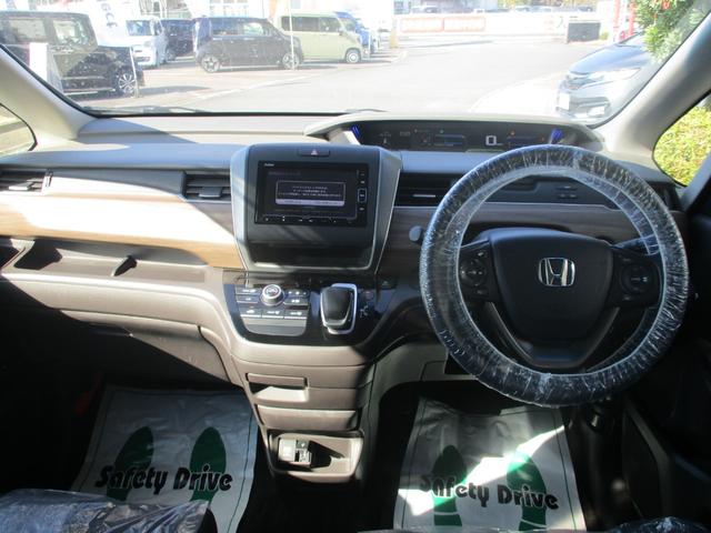 フリードハイブリッド ハイブリッド・Ｇホンダセンシング　バックカメラ　ＥＴＣ　衝突被害軽減ブレーキ　３列シート　両側電動スライドドア　純正ナビ　盗難防止装置　前後ドライブレコーダー（5枚目）