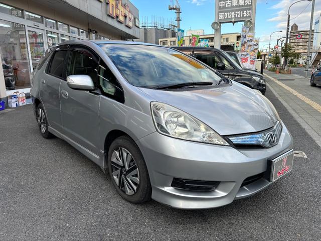 フィットシャトルハイブリッド ハイブリッド・スマートセレクション　助手席回転シート　ハーフレザー　スマートキー２個　Ｈ２５年からＲ７年ディーラー記録簿　純正メモリーナビ　バックカメラ　ＣＤ／ＤＶＤ再生可　ワンセグＴＶ　ＥＴＣ　ノーマルクルコン　ＨＩＤオートライト（7枚目）