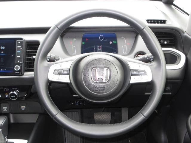 フィット ｅ：ＨＥＶホーム　禁煙車ホンダセンシング純正９インチメモリーナビＢｌｕｅｔｏｏｔｈＥＴＣＲカメラワンオーナー　前後ブレーキサポート　盗難防止　クリアランスソナー　ＥＣＯモード　１オーナー　バックガイドモニター　キーレス（11枚目）