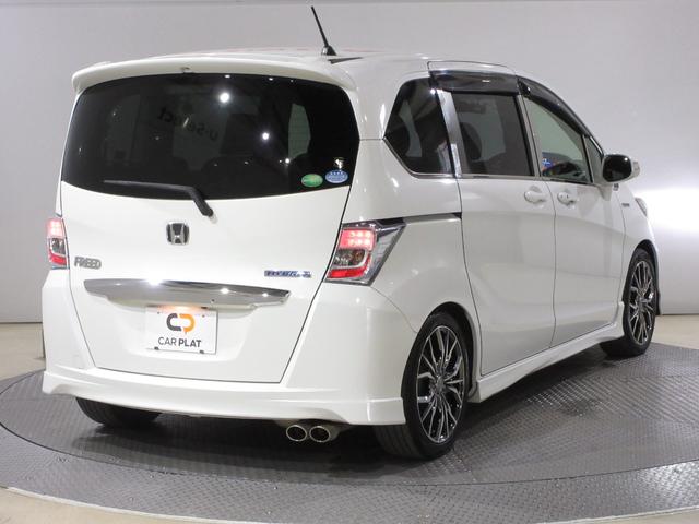 フリードハイブリッド ジャストセレクション　／禁煙車／メモリーナビ／ワンセグ／Ｒカメラ／ＵＳＢ／ＣＤ／ＤＶＤ／ＥＴＣ／ドラレコ／クルコン／スマートキー／ローダウン／社外フロントグリル／社外１７インチＡＷ／ディスチャージヘッドライト／ＡＢＳ／（7枚目）