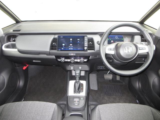 フィット e:HEVホーム 禁煙 当社元試乗車 純正9インチプレミアムインターナビ Bluetooth ドラレコ Rカメラ ETC 本革巻ステアリングホイール 本革巻セレクトレバー USBチャージャー 電子制御パーキングブレーキ(10枚目)