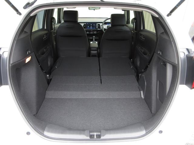 フィット e:HEVホーム 禁煙 当社元試乗車 純正9インチプレミアムインターナビ Bluetooth ドラレコ Rカメラ ETC 本革巻ステアリングホイール 本革巻セレクトレバー USBチャージャー 電子制御パーキングブレーキ(22枚目)