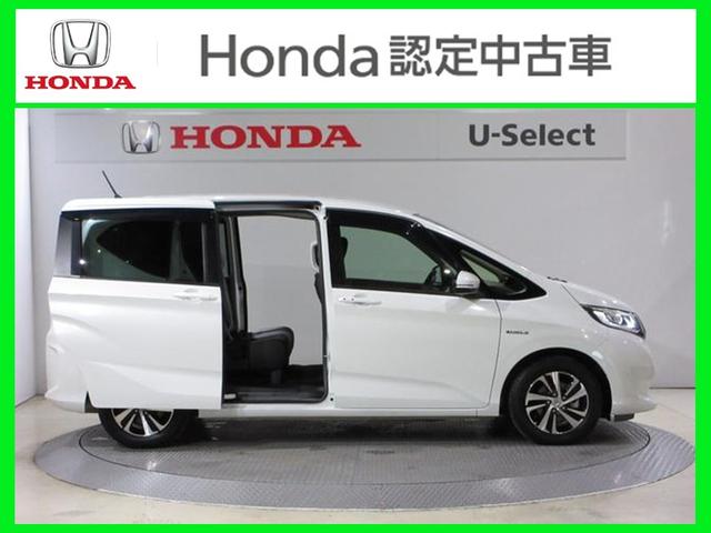 フリードハイブリッド ハイブリッド・Gホンダセンシング ・雹害 ・2列目ベンチシート(7人乗り) ・車検…令和9年3月 ・純正9インチナビ ・リアカメラ ・ETC ・両側電動スライドドア ・ホンダセンシング ・Bluetooth AUDIO ・1年保証付(8枚目)