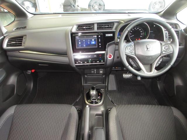 フィットハイブリッド Ｓホンダセンシング　純正メモリーナビＢｌｕｅｔｏｏｔｈＥＴＣＲカメラ　スマ－トキ－　ナビＴＶ　禁煙　アクティブクルーズコントロール　パワーウインドウ　サイドエアバック　ＤＶＤ再生　パワーステアリング　整備記録簿　ＡＢＳ（2枚目）