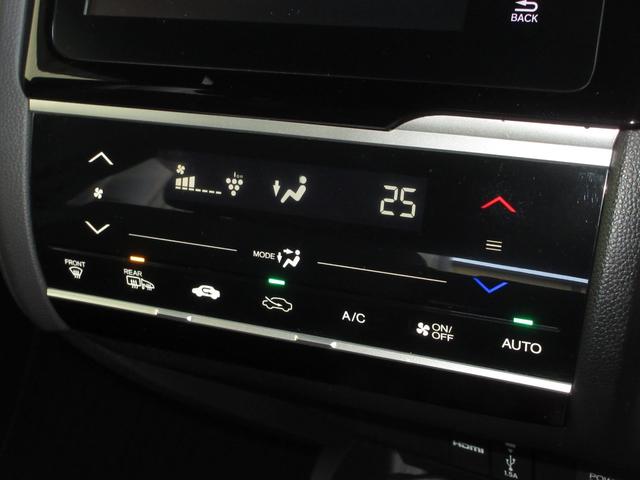 フィットハイブリッド Ｓホンダセンシング　純正メモリーナビＢｌｕｅｔｏｏｔｈＥＴＣＲカメラ　スマ－トキ－　ナビＴＶ　禁煙　アクティブクルーズコントロール　パワーウインドウ　サイドエアバック　ＤＶＤ再生　パワーステアリング　整備記録簿　ＡＢＳ（20枚目）