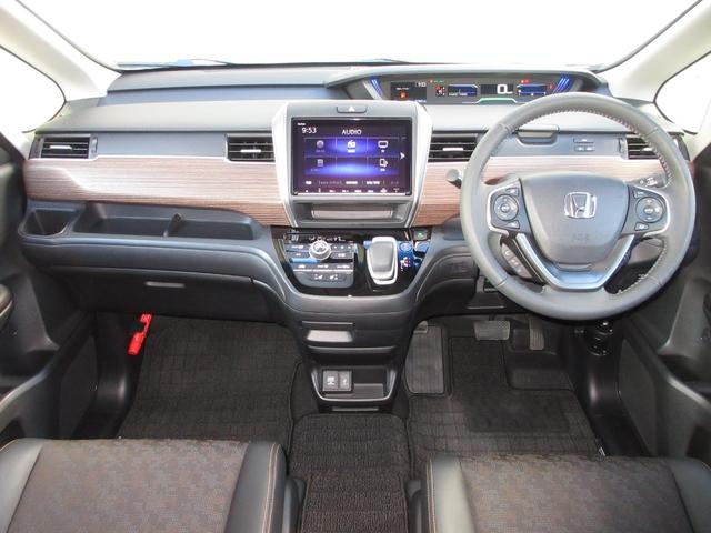 フリードハイブリッド ハイブリッド・クロスター　ワンオーナー　禁煙　２年保証　車検整備付　６人乗り　９インチメモリーナビ　フルセグＴＶ　ミュージックサーバー　ＢＴオーディオ接続　リアカメラ　ＥＴＣ　シートヒーター　ヒーター付ドアミラー　スマートキー（8枚目）