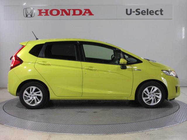 フィットハイブリッド Ｌパッケージ　Ｕ－Ｓｅｌｅｃｔ稲城オープン　純正メモリーナビＥＴＣＲカメラ　禁煙　ナビ＆ＴＶ　地デジフルセグＴＶ　サイドエアバック　ＤＶＤ再生　ＬＥＤ　ＥＣＯＮ　バックカメラ　クルーズコントロール　ＡＵＴＯエアコン（6枚目）