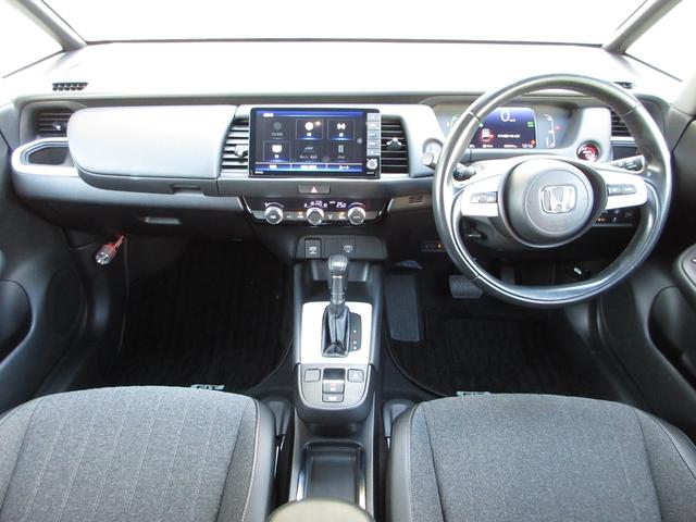フィット e:HEVホーム ・ワンオーナー ・禁煙 ・5万9千キロ ・車検…令和9年8月 ・純正9インチナビ ・リアカメラ ・ETC ・ホンダセンシング ・前後ドラレコ ・ドアバイザー ・LEDヘッドライト ・1年保証(2枚目)