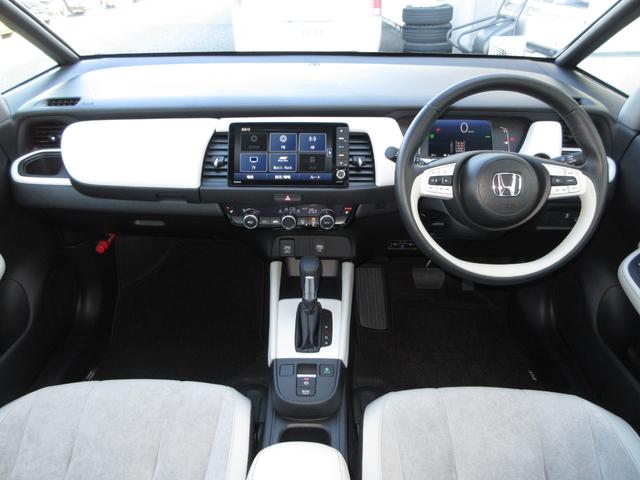 フィット e:HEVホーム ホンダセンシング純正9インチメモリーナビBluetoothドラレコRカメラETCワンオーナー 前後誤発進抑制機能 クリソナ 助手席エアバッグ 運転席エアバッグ 1オナ シートヒーター LEDライト(10枚目)