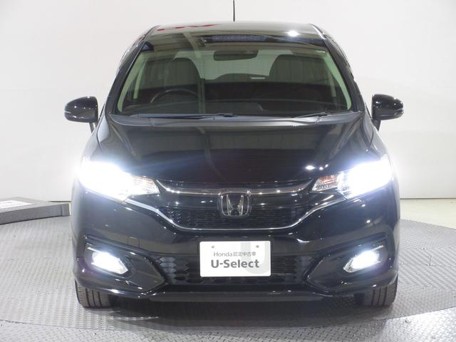 フィットハイブリッド Ｌホンダセンシング　純正メモリーナビＢｌｕｅｔｏｏｔｈＥＴＣＲカメラ　軽減ブレーキ　ＬＥＤ　サイドＳＲＳ　横滑り防止　フルセグテレビ　ナビＴＶ　パワーステアリング　盗難防止装置　オートクルーズ　ＥＴＣ車載器　ＤＶＤ再生（5枚目）