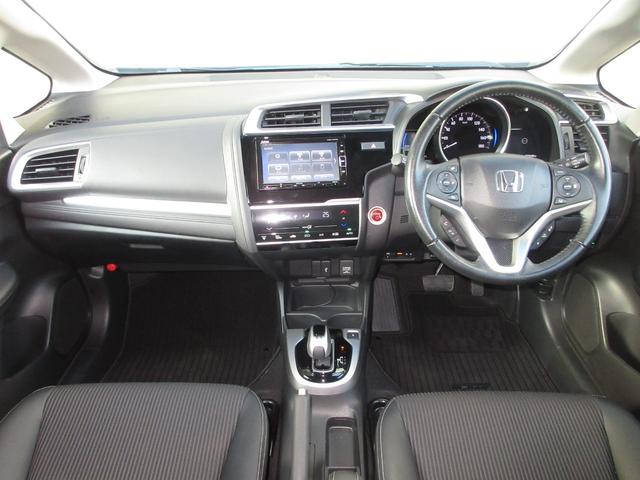 フィットハイブリッド Ｌホンダセンシング　純正メモリーナビＢｌｕｅｔｏｏｔｈＥＴＣＲカメラ　軽減ブレーキ　ＬＥＤ　サイドＳＲＳ　横滑り防止　フルセグテレビ　ナビＴＶ　パワーステアリング　盗難防止装置　オートクルーズ　ＥＴＣ車載器　ＤＶＤ再生（9枚目）