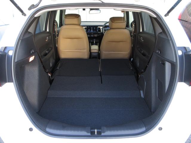 フィット ｅ：ＨＥＶリュクス　禁煙車ホンダセンシング純正９インチメモリーナビＢｌｕｅｔｏｏｔｈＥＴＣＲカメラワンオーナー　誤発進抑制機能　Ｉオーナー　リアカメラ　ＥＴＣ付　ＬＥＤ　シートヒーター　クルーズコントロール　ＤＶＤ（21枚目）