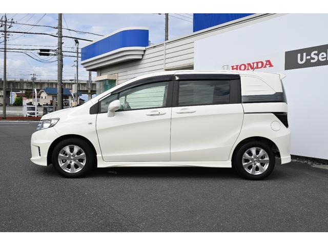 フリードスパイク Ｇエアロ　雹害現状車　純正ナビ　ワンセグ　ＦＲカメラ　ＥＴＣ　アルミホイール　ＨＩＤライト　左ＰＷスライドドア　１オーナー車　インテリキー　Ｂカメ　キーレス　ナビＴＶ　整備記録簿　助手席エアバッグ　ＡＡＣ（8枚目）