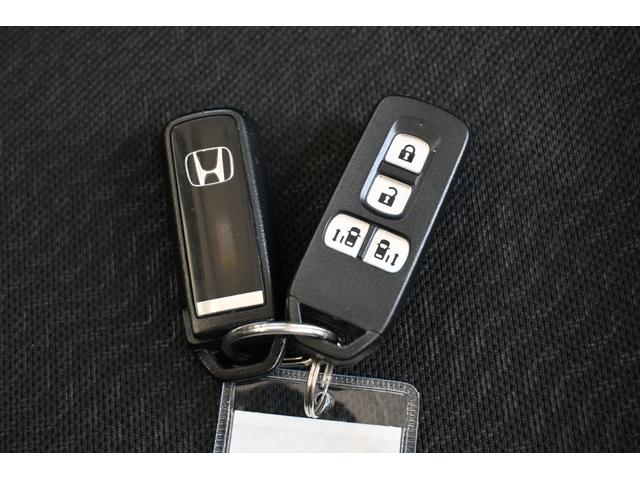 N-BOXカスタム GSSパッケージ 追突軽減ブレーキ 純正ナビ ワンセグ Rカメラ HIDライト アルミホイール 両側Pスライドドア 両側パワ-スライドドア TVナビ 整備記録簿 スマ-トキ- 1オーナ Bカメ エアコン ESC DVD(15枚目)