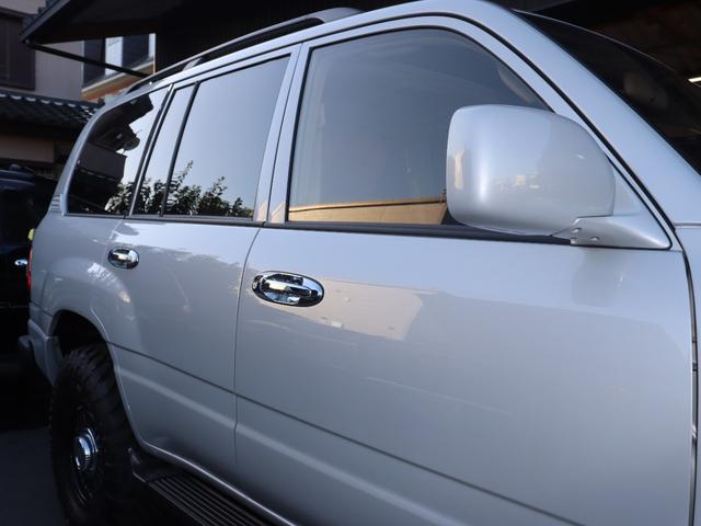 ランドクルーザー100 VXリミテッド Gセレクション BMW MINI純正カラーアイスシルバーオールペイント Gセレクション ハイトコントロール DEANカルフォルニアAW オープンカントリー255/85/16MT サクソンオリジナルマフラー(33枚目)