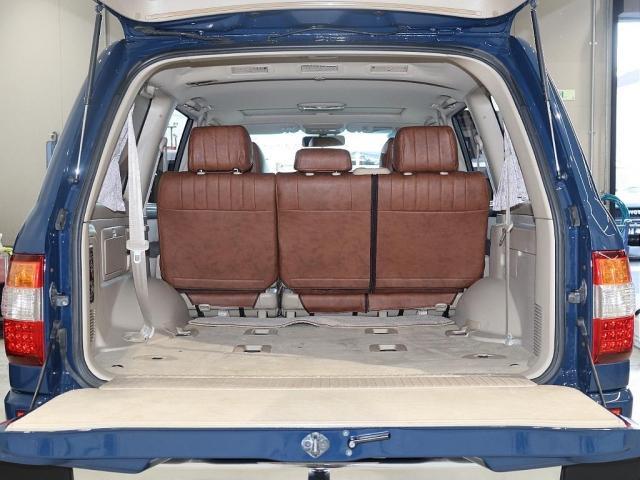 ランドクルーザー１００ ＶＸリミテッド　Ｇセレクション　再販７０純正ブルー　グレードＧセレクション　サンルーフ　丸目ヘッドライト換装　ＤＥＡＮ　カリフォルニアホイール　オープンカントリー２３５／８５／１６ＭＴ　ｃａｒｒｏｚｚｅｒｉａ７インチフルセグナビ搭載（4枚目）