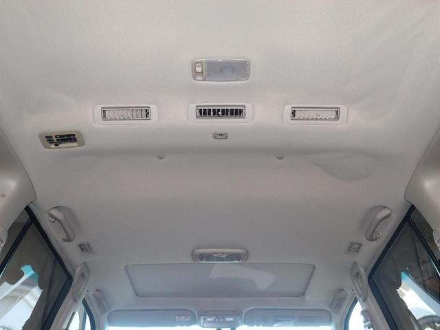 ランドクルーザー１００ ＶＸリミテッド　Ｇセレクション　再販７０純正ブルー　グレードＧセレクション　サンルーフ　丸目ヘッドライト換装　ＤＥＡＮ　カリフォルニアホイール　オープンカントリー２３５／８５／１６ＭＴ　ｃａｒｒｏｚｚｅｒｉａ７インチフルセグナビ搭載（13枚目）