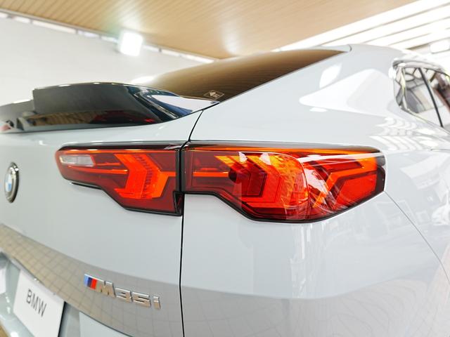 X2 M35i xDrive ディスプレイオーディオ 赤黒革シート パワーシート ハーマンカードン HUD 全方位カメラ ワイヤレス充電 純正前後ドラレコ シートヒーター ステアリングヒーター パワーバックドア アンビエントライト(55枚目)