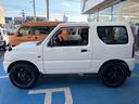 ジムニー XG 4WD CDオーディオ ETC ABS PS PW 衝突安全ボディ キーレスエントリー 運転席エアバッグ 助手席エアバッグ フルフラット シートカバー 社外ホワイトレタータイヤ&ホイール 中古車画像_4