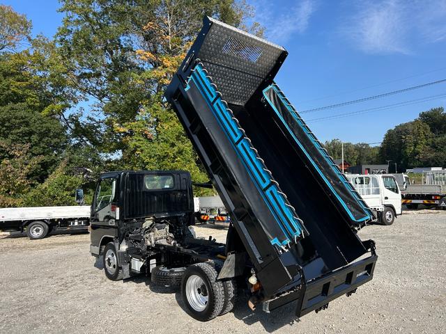 キャンター 全低床ダンプ　１年保証付き　２ｔ　強化ダンプ　ＭＴ車　電動格納ミラー　コボレーン　荷台内寸　長さ３０５０ｍｍ　幅１５９０ｍｍ　フロントフォグランプ　２トン　２トンダンプ　２ｔダンプ　ディーゼルターボ　横滑り防止装置（52枚目）