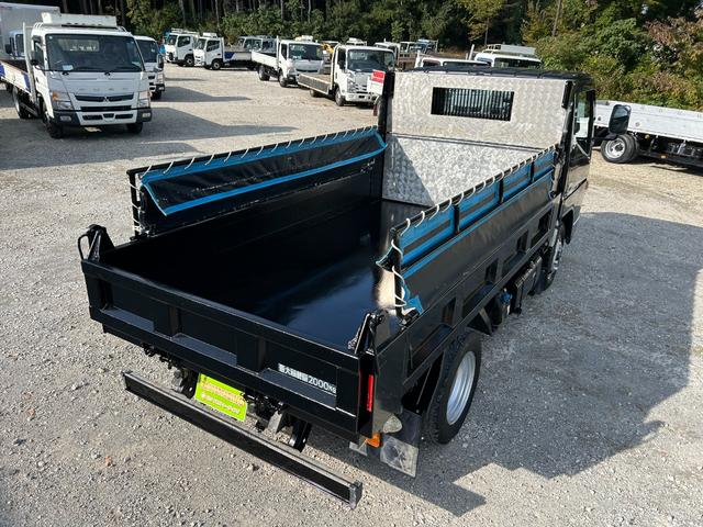 キャンター 全低床ダンプ　１年保証付き　２ｔ　強化ダンプ　ＭＴ車　電動格納ミラー　コボレーン　荷台内寸　長さ３０５０ｍｍ　幅１５９０ｍｍ　フロントフォグランプ　２トン　２トンダンプ　２ｔダンプ　ディーゼルターボ　横滑り防止装置（57枚目）