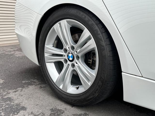 ３シリーズ ３２０ｉ　スポーツ　サンルーフ　純正ナビ　Ｂカメラ　ＥＴＣ　クルコン　ＨＩＤヘッドライト　社外サスペンション　フロントスポイラー　スマートキー　スペアキー　障害物センサー　レーダー探知機　パワーシート（64枚目）