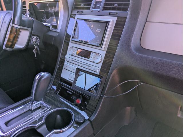 リンカーンナビゲーター ベースグレード　ディーラー車・８ナンバー・車椅子移動車登録・社外ナビ・フルセグ・ＡＬＰＩＮＥフリップダウンモニター・ＥＴＣ・キーレス・パワーバックドア・バックカメラ・フロントカメラ・右サイドカメラ・パワーシート（50枚目）