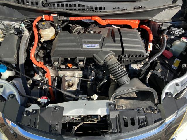 オデッセイハイブリッド ハイブリッドアブソルート・ホンダセンシング　マルチビューカメラシステム　大型アームレスト　フリップダウンモニター　純正ナビ　ＴＶ　センターコンソールボックス　前後ドラレコ　クリアランスソナ　レーダークルコン　パークアシスト　衝突被害軽減　ＥＴＣ（27枚目）