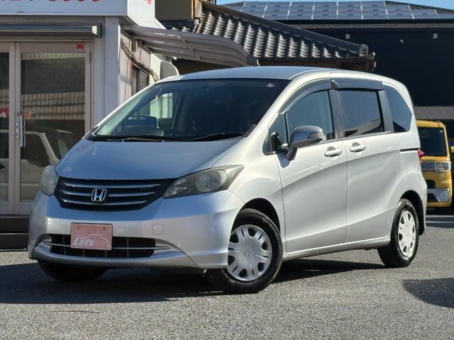 フリード Ｇ　ハイウェイエディション　純正７インチナビ　片側パワースライドドア　Ｂカメラ　ワンセグナビ　ＣＤ／ＤＶＤ再生　取説　スペアキー　マット　純正バイザー　オートエアコン　７人乗り　ヨコハマ８分山タイヤ　跳ね上げ３列目シート（2枚目）