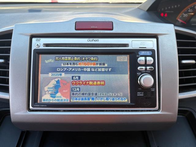 フリード Ｇ　ハイウェイエディション　純正７インチナビ　片側パワースライドドア　Ｂカメラ　ワンセグナビ　ＣＤ／ＤＶＤ再生　取説　スペアキー　マット　純正バイザー　オートエアコン　７人乗り　ヨコハマ８分山タイヤ　跳ね上げ３列目シート（35枚目）