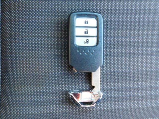 フリード G 禁煙車 Bluetooth対応 純正メモリーナビ フルセグ DVD/CD ETC リアカメラ VSA スマートキー 左側電動スライドドア 片側電動両側スライドドア 記録簿 3列シート パワーウインドウ(22枚目)