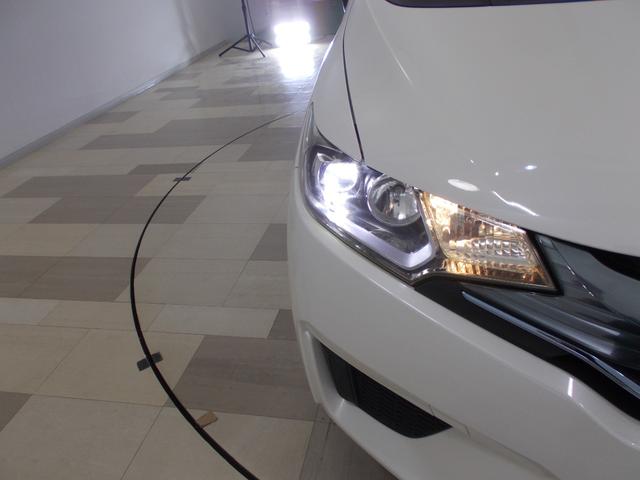 フィットハイブリッド Fパッケージ 禁煙車 あんしんP 純ナビ リアカメラ SD CD/DVD LED ETC ECON VSA 左側面修理しており修復歴車 雹害車 盗難警報装置 ワンオ-ナ-車 記録簿有り AUTOエアコン リヤカメラ(21枚目)