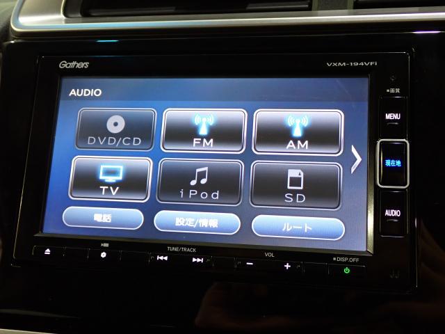 フィットハイブリッド Lホンダセンシング Rカメ 禁煙 LED サイドSRS 横滑り防止 フルセグテレビ 記録簿 ナビTV パワーステアリング 盗難防止装置 オートクルーズ ETC車載器 DVD再生 ABS スマートキー 軽減ブレーキ USB(5枚目)