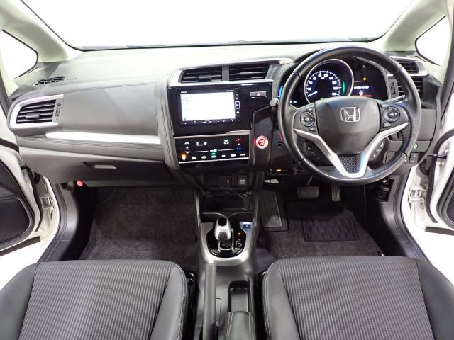 フィットハイブリッド Lホンダセンシング Rカメ 禁煙 LED サイドSRS 横滑り防止 フルセグテレビ 記録簿 ナビTV パワーステアリング 盗難防止装置 オートクルーズ ETC車載器 DVD再生 ABS スマートキー 軽減ブレーキ USB(6枚目)