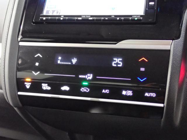 フィットハイブリッド Lホンダセンシング Rカメ 禁煙 LED サイドSRS 横滑り防止 フルセグテレビ 記録簿 ナビTV パワーステアリング 盗難防止装置 オートクルーズ ETC車載器 DVD再生 ABS スマートキー 軽減ブレーキ USB(9枚目)