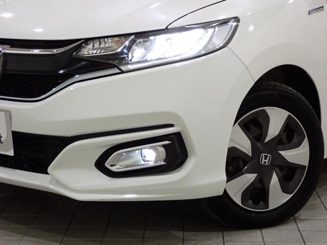 フィットハイブリッド Lホンダセンシング Rカメ 禁煙 LED サイドSRS 横滑り防止 フルセグテレビ 記録簿 ナビTV パワーステアリング 盗難防止装置 オートクルーズ ETC車載器 DVD再生 ABS スマートキー 軽減ブレーキ USB(19枚目)