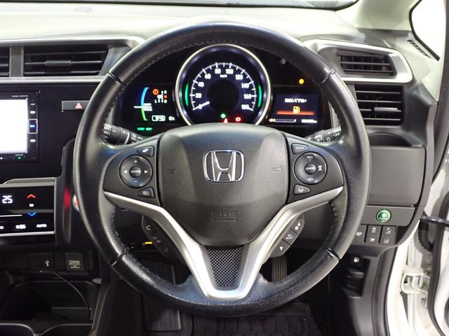 フィットハイブリッド Lホンダセンシング Rカメ 禁煙 LED サイドSRS 横滑り防止 フルセグテレビ 記録簿 ナビTV パワーステアリング 盗難防止装置 オートクルーズ ETC車載器 DVD再生 ABS スマートキー 軽減ブレーキ USB(29枚目)