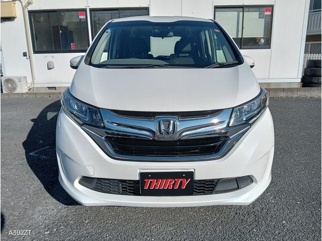 フリードハイブリッド ハイブリッド・ＥＸ　ホンダセンシング　９インチフローティングナビ　ＡＣＣ　後席モニター２個　両側パワースライド　ＬＥＤライト　シートヒーター　バックカメラ　フルセグＴＶ　プリクラッシュセーフティー　車線逸脱警告　６人乗（5枚目）