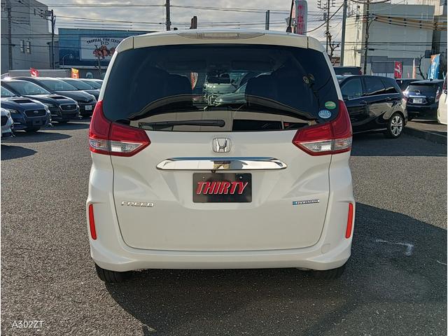 フリードハイブリッド ハイブリッド・ＥＸ　ホンダセンシング　９インチフローティングナビ　ＡＣＣ　後席モニター２個　両側パワースライド　ＬＥＤライト　シートヒーター　バックカメラ　フルセグＴＶ　プリクラッシュセーフティー　車線逸脱警告　６人乗（10枚目）