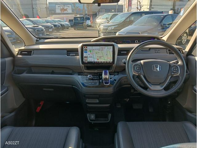 フリードハイブリッド ハイブリッド・ＥＸ　ホンダセンシング　９インチフローティングナビ　ＡＣＣ　後席モニター２個　両側パワースライド　ＬＥＤライト　シートヒーター　バックカメラ　フルセグＴＶ　プリクラッシュセーフティー　車線逸脱警告　６人乗（12枚目）