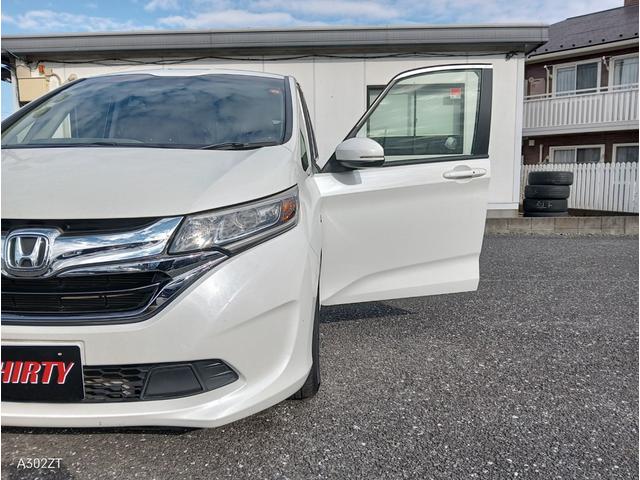 フリードハイブリッド ハイブリッド・ＥＸ　ホンダセンシング　９インチフローティングナビ　ＡＣＣ　後席モニター２個　両側パワースライド　ＬＥＤライト　シートヒーター　バックカメラ　フルセグＴＶ　プリクラッシュセーフティー　車線逸脱警告　６人乗（65枚目）