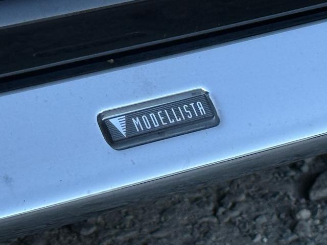 エスクァイア ハイブリッドＧｉ　後期型　モデリスタフルエアロ　モデリスタリアスポイラー　ＲＡＹＳ１８インチＡＷ　純正１０インチナビ　純正１２．８インチフリップダウンモニター　社外スモークテール　社外ＬＥＤリフレクター　黒革シート（12枚目）