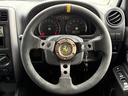 ジムニー ＸＧ　６型　５ＭＴ　車検２年付　猪狩バンパー　リフトアップ　ブリスターフェンダー　ナンバー移設キット　社外マフラー　社外１６インチＡＷ　社外エアクリ　社外ステアリング　社外テール　社外ラテラル　防錆塗装済（6枚目）