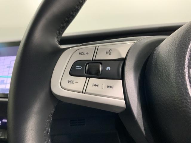 フィット e:HEVホーム H SENSING 新車保証 試乗車 ワンオ-ナ- ナビLXM-242ZFNI TV Rカメラ BTオ-ディオ ETC LEDライト VSA クルコン スマ-トキ- スペアキ-盗難防止装置 整備記録簿(11枚目)