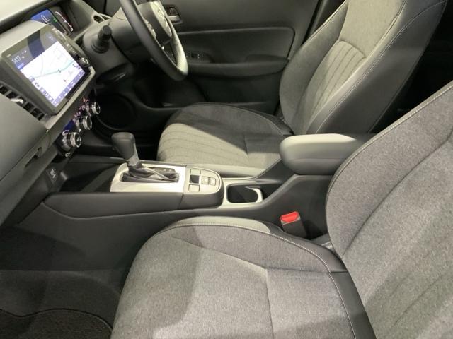 フィット e:HEVホーム H SENSING 新車保証 試乗車 ワンオ-ナ- ナビLXM-242ZFNI TV Rカメラ BTオ-ディオ ETC LEDライト VSA クルコン スマ-トキ- スペアキ-盗難防止装置 整備記録簿(29枚目)