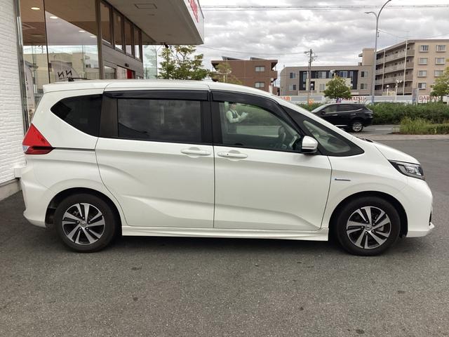 フリードハイブリッド ハイブリッド・ＥＸ　ワンオーナー／禁煙車／ホンダ純正９インチナビ／ＥＴＣ／両側電動スライドドア　１オナ　地デジフルセグＴＶ　シ－トヒ－タ－　整備記録簿　リヤカメラ　ＬＥＤライト　フルオートエアコン　ＡＢＳ　ＤＶＤ再生可（4枚目）
