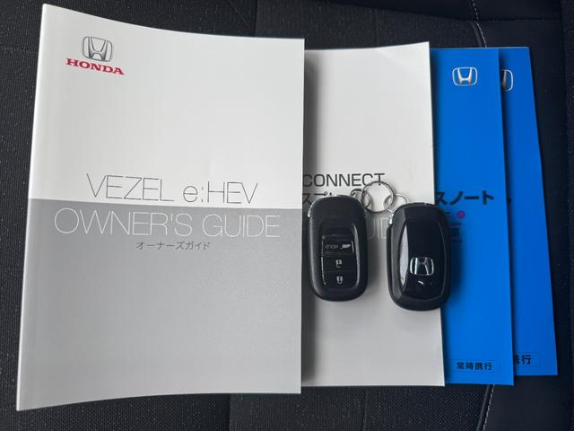 ヴェゼル ｅ：ＨＥＶＺ　１オーナー禁煙車ＥＴＣ２．０純正ドラレコ前後パワーリアゲート　衝突回避支援ブレーキ機能　１オナ　スマキ　Ｐトランク　フルオートエアコン　Ｄレコ　エアバッグ　両席エアバック　Ｒカメ　記録簿付　ソナー（52枚目）