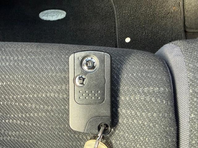 ゼストスパーク W 社外ナビ Bluetooth ETC バックカメラ スマートキー ドライブレコーダー 電動格納ミラー HIDヘッドライト 禁煙車 スペアタイヤ(19枚目)