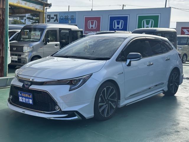 カローラツーリング ハイブリッド ダブルバイビー モデリスタエアロ&アルミホイール付 セーフティセンス LEDヘッドランプ ディスプレイオーディオ ヘッドアップディスプレイ スペアタイヤ 本革巻ステアリング シートヒーター ステアリングヒーター(4枚目)