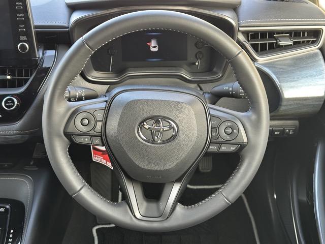 カローラツーリング ハイブリッド ダブルバイビー モデリスタエアロ&アルミホイール付 セーフティセンス LEDヘッドランプ ディスプレイオーディオ ヘッドアップディスプレイ スペアタイヤ 本革巻ステアリング シートヒーター ステアリングヒーター(9枚目)